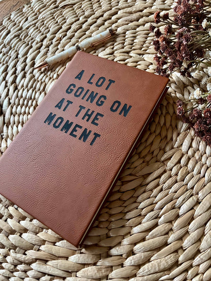 A lot going on Leatherette Journal: Brown w/ Black Text